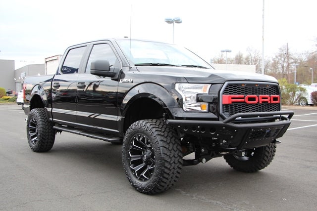 Black Custom Lifted F-150 with Red Grille at All American Auto Group in Old Bridge NJ
